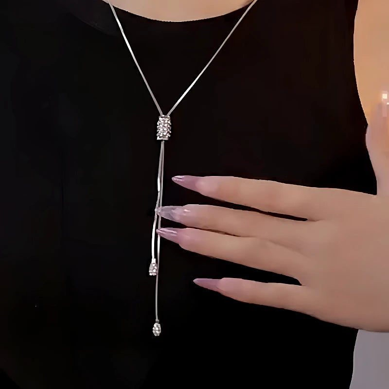 Detailed view of the 14K Gold-Plated Diamond Tassel Sweater Chain Necklace chain and pendant