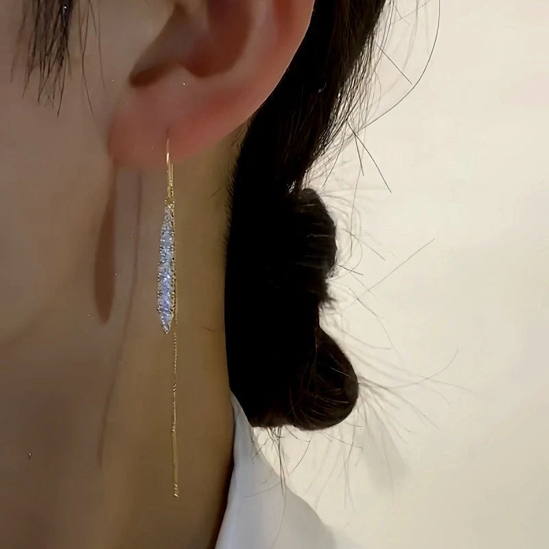 Close-up detail of the sparkling zircons and plating on the Tassel Threader Earrings