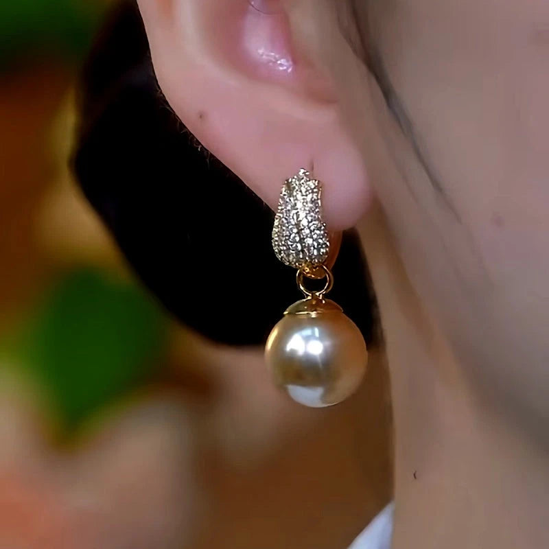 Close-up detail of the sparkling zircons and plating on the Tulip Pearl Earrings