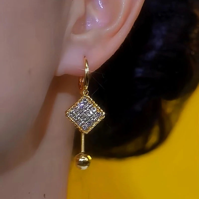 Close-up detail of the sparkling zircons and plating on the Water Drop Earrings