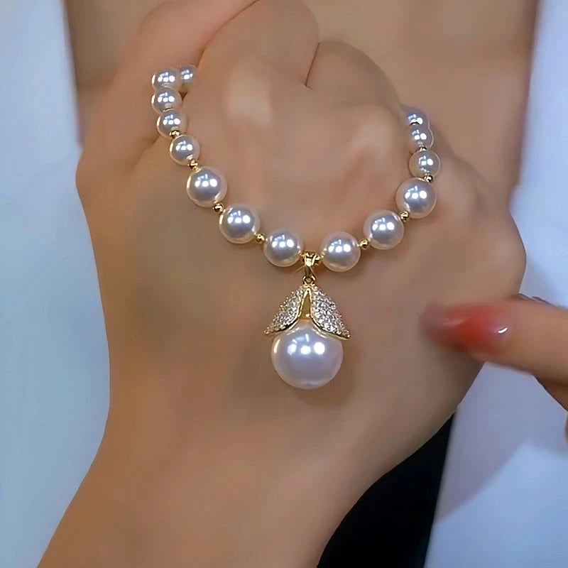 Close-up of the pendant and clasp on the White Pearl Necklace