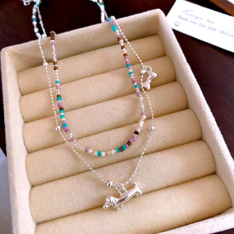 Close-up of the pendant and clasp on the Puppy Necklace