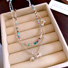 Close-up of the pendant and clasp on the Puppy Necklace