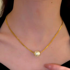 Close-up of the pendant and clasp on the Double-Layer Pearl Necklace