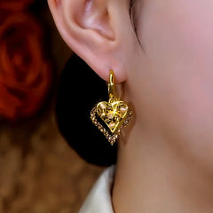 Close-up detail of the sparkling zircons and plating on the Heart Earrings