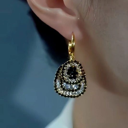 Model showcasing the dangle and style of the 14K Gold-Plated Double-Layer Diamond Earrings