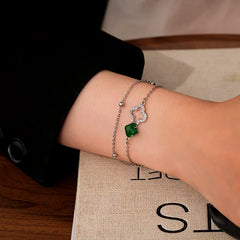 Close-up of the clasp and charm details on the Four-Leaf Bracelet