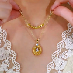 14K Gold-Plated Double-Layer Luck Beads Gold Wire Hollow Necklace worn to showcase its length and pendant detail