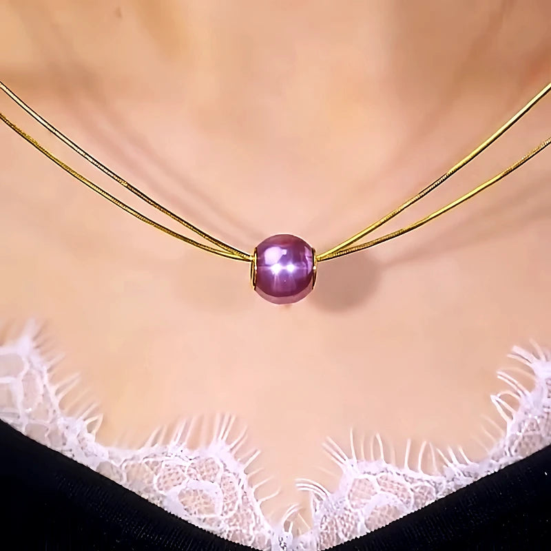 Detailed view of the 14K Gold-Plated Double-Layer Pearl Earrings chain and pendant