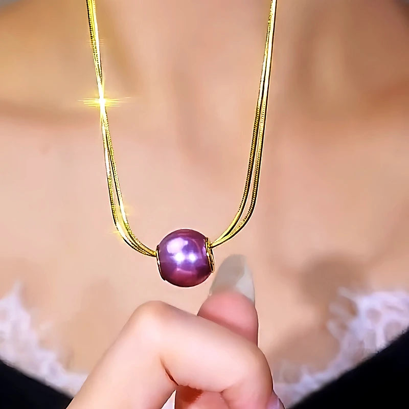 14K Gold-Plated Double-Layer Pearl Earrings worn to showcase its length and pendant detail