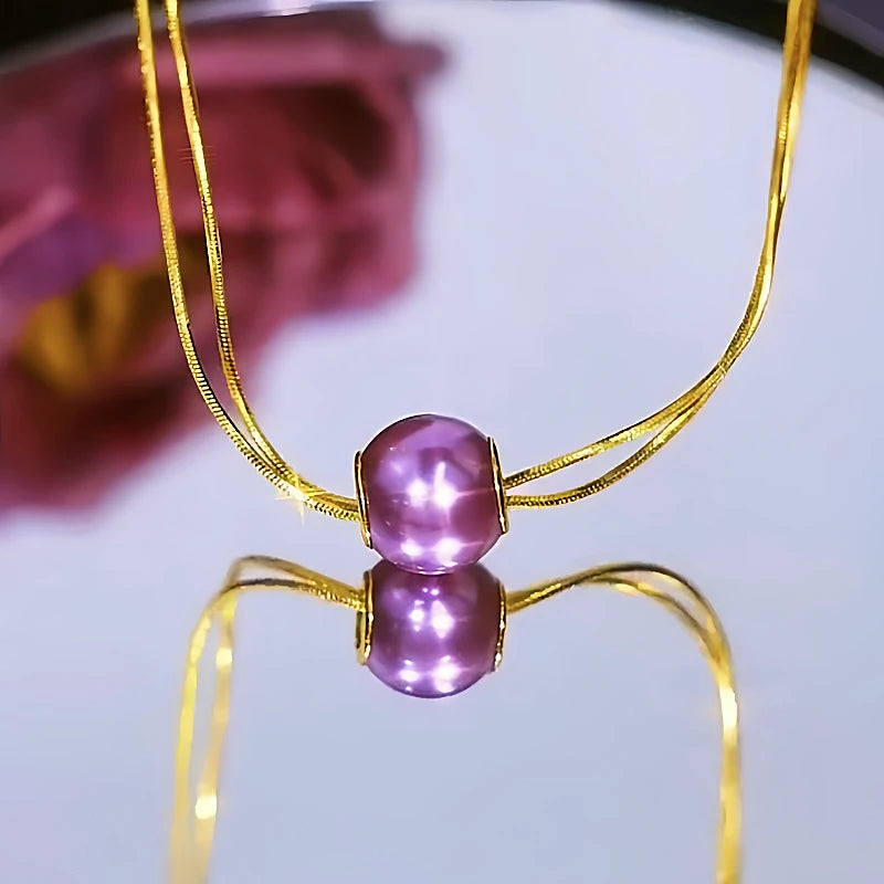 Close-up of the pendant and clasp on the Double-Layer Pearl Earrings