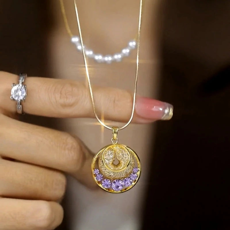 Close-up of the pendant and clasp on the Purple Zircon Necklace