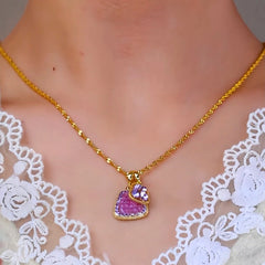 Close-up of the pendant and clasp on the Purple Crystal Necklace