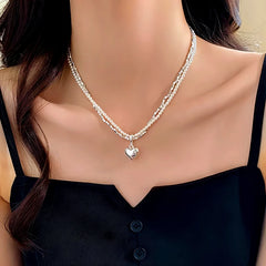 14K Gold-Plated Double-Layer Silver Heart Pendant Necklace worn to showcase its length and pendant detail