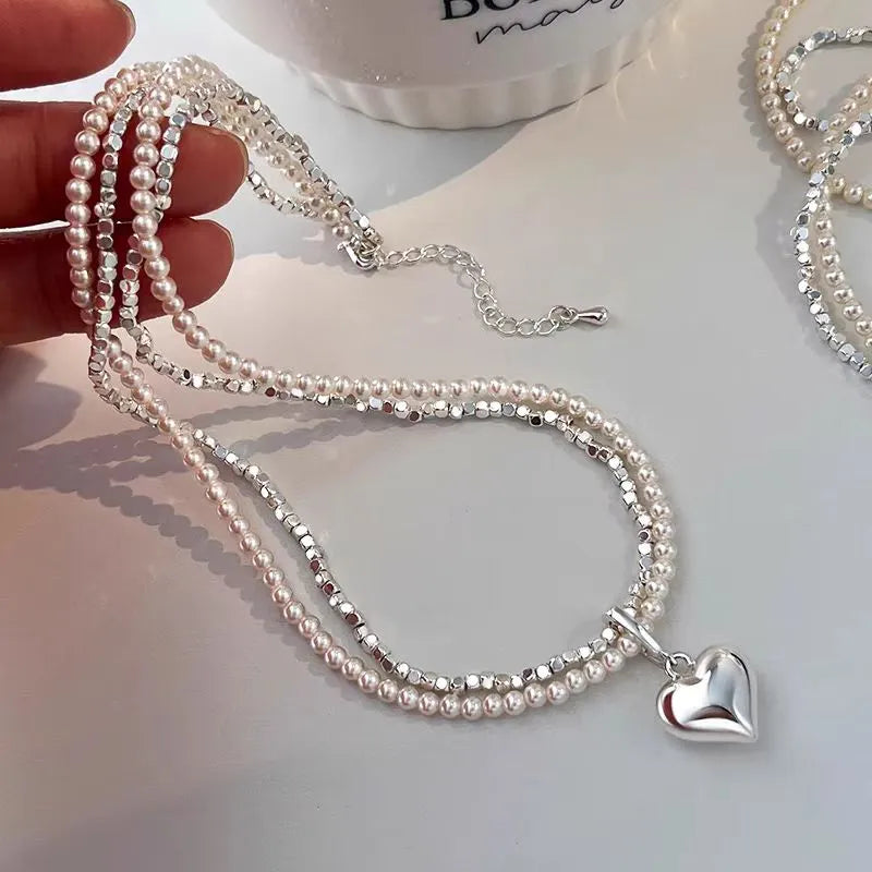 Close-up of the pendant and clasp on the Silver Heart Necklace