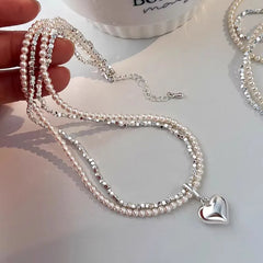 Close-up of the pendant and clasp on the Silver Heart Necklace