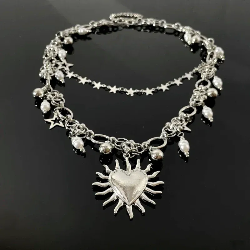 Close-up of the pendant and clasp on the Star Heart Necklace