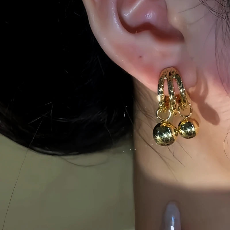 Close-up detail of the sparkling zircons and plating on the Water Drop Earrings