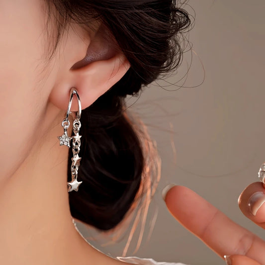 Model showcasing the dangle and style of the 14K Gold-Plated Double-Layer Zircon Star Tassel Earrings