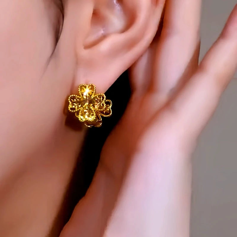 Angled view of the 14K Gold-Plated Double-Sided Cat's Eye Flower Earrings