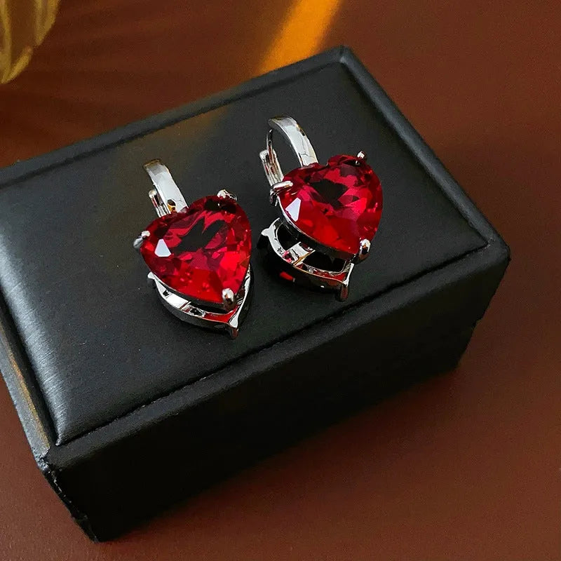 Angled view of the 14K Gold-Plated Double-Sided Contrasting Heart Earrings