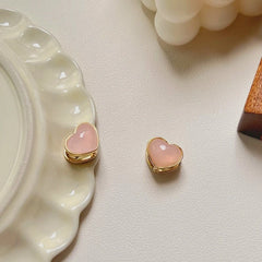 Close-up detail of the sparkling zircons and plating on the Double-Sided Heart Earrings