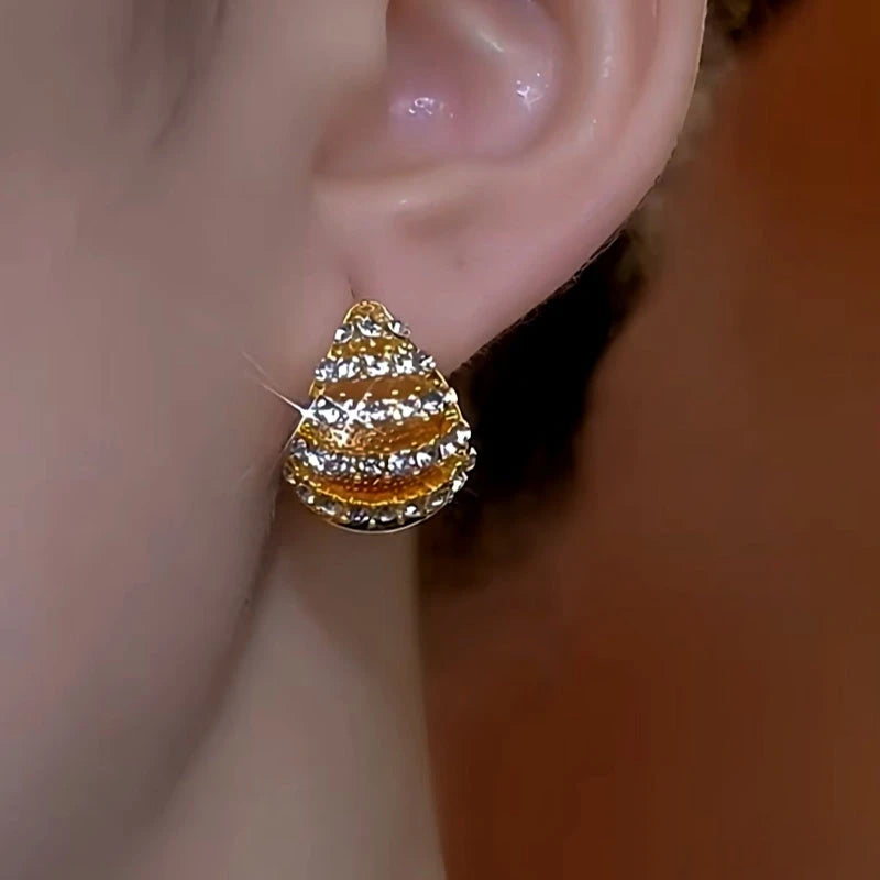 Model showcasing the dangle and style of the 14K Gold-Plated Double-Sided Oil Drop Diamond Water Drop Earrings