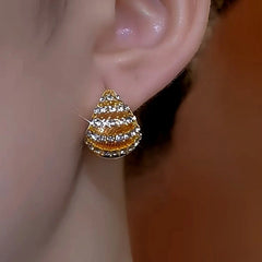 Model showcasing the dangle and style of the 14K Gold-Plated Double-Sided Oil Drop Diamond Water Drop Earrings