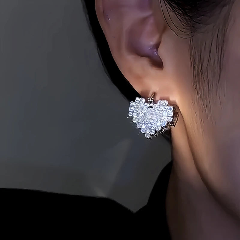 Close-up detail of the sparkling zircons and plating on the Double-Sided Heart Earrings