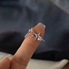 Model showcasing the dangle and style of the 14K Gold-Plated Double Cross Star Diamond Ear Clips