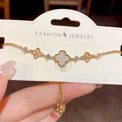 Close-up of the clasp and charm details on the Adjustable Four-Leaf Bracelet