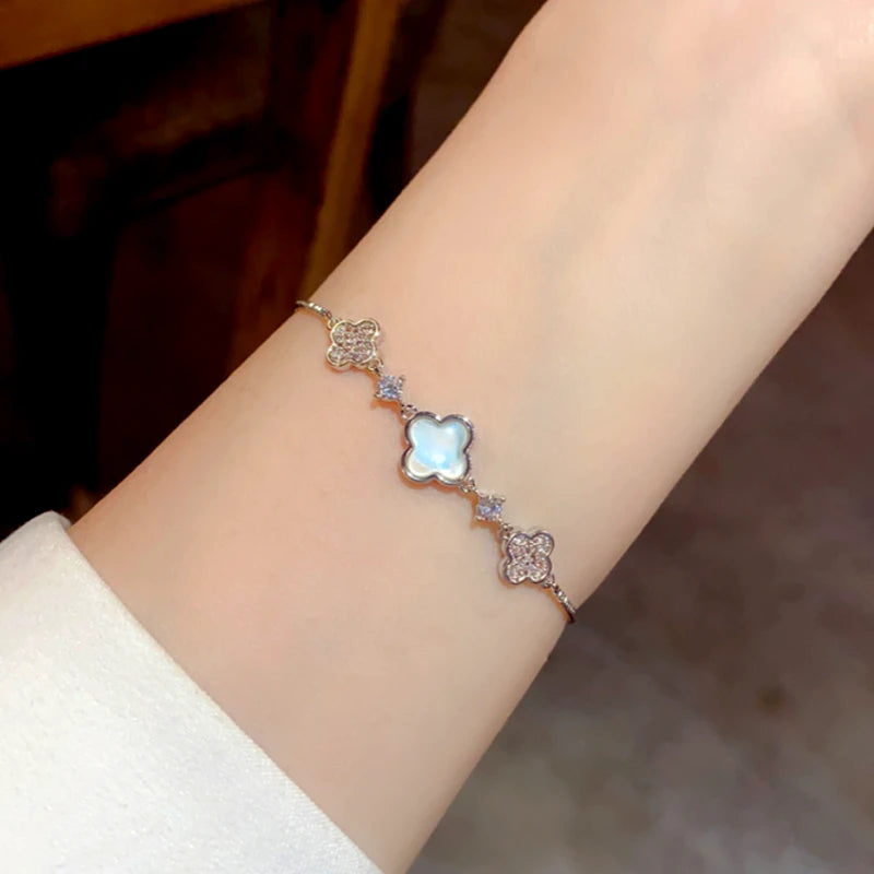 Model wearing the 14K Gold-Plated Elegant Adjustable Zircon Four-Leaf Bracelets to highlight its design on the wrist