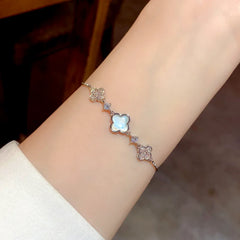 Model wearing the 14K Gold-Plated Elegant Adjustable Zircon Four-Leaf Bracelets to highlight its design on the wrist