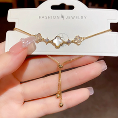 Close-up of the clasp and charm details on the Adjustable Four-Leaf Bracelets