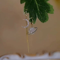 Close-up detail of the sparkling zircons and plating on the Asymmetrical Moon Earrings