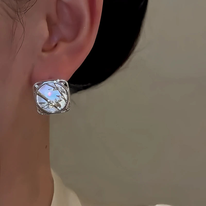 Model showcasing the dangle and style of the 14K Gold-Plated Elegant Bamboo Mirror Rings