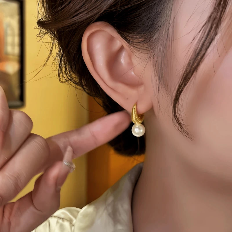 Close-up detail of the sparkling zircons and plating on the Gold Bead Earrings