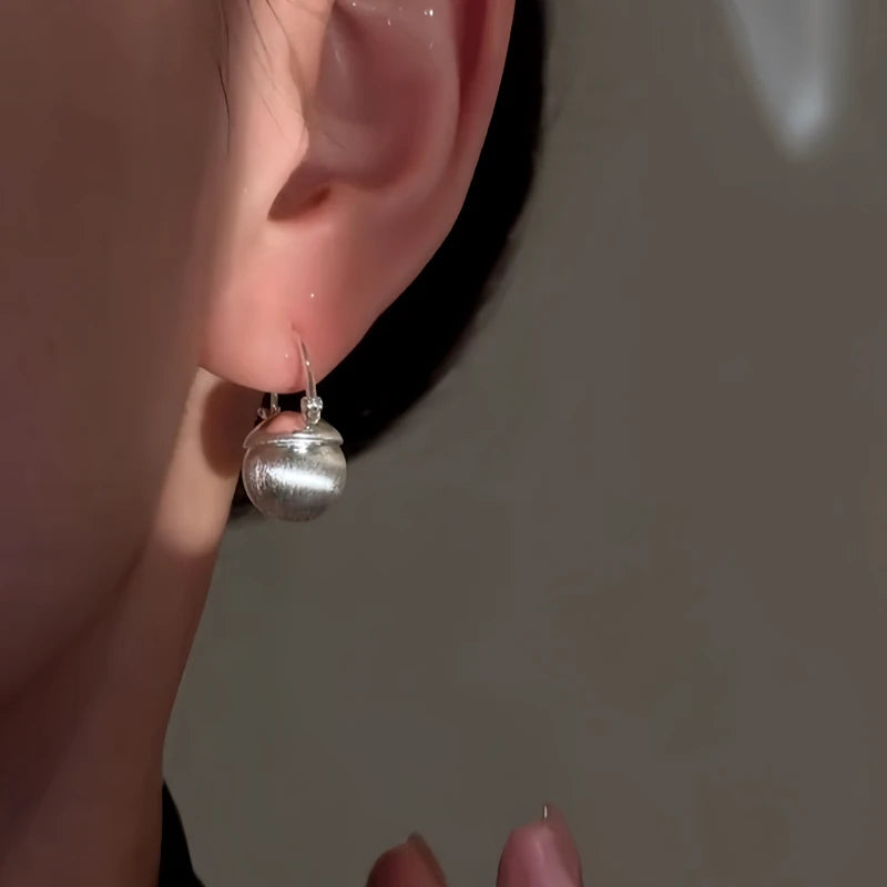 Close-up detail of the sparkling zircons and plating on the Bead Earrings