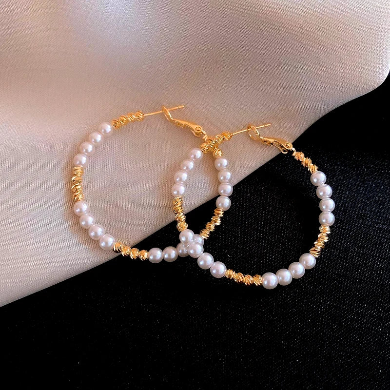 Angled view of the 14K Gold-Plated Elegant Bead Hoop Earrings