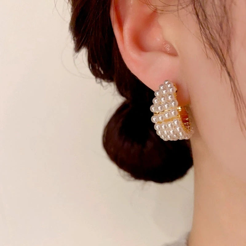 Close-up detail of the sparkling zircons and plating on the Gold Beaded Earrings