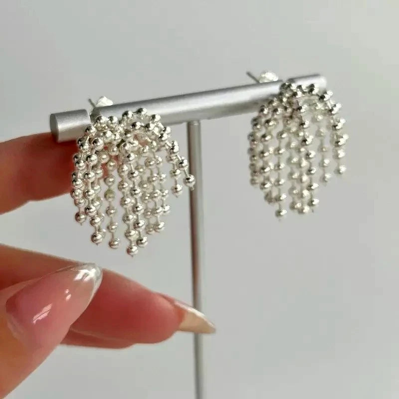 Close-up detail of the sparkling zircons and plating on the Beaded Tassel Earrings