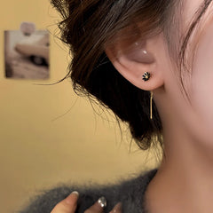 Close-up detail of the sparkling zircons and plating on the Flower Threader Earrings