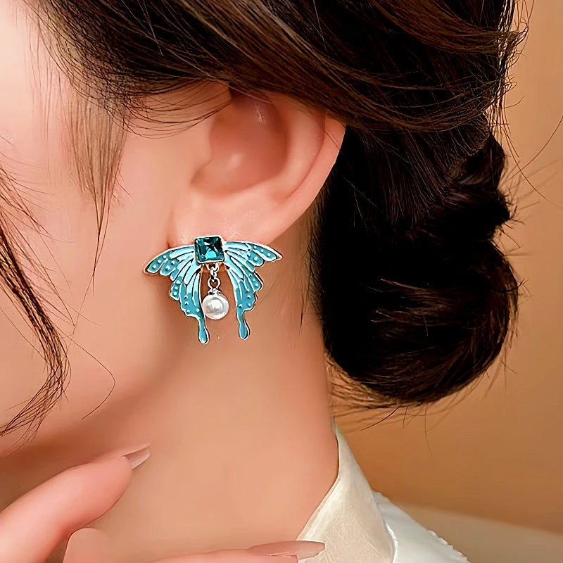 Close-up detail of the sparkling zircons and plating on the Blue Butterfly Earrings