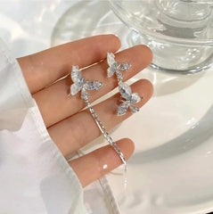 Angled view of the 14K Gold-Plated Elegant Blue Crystal Butterfly Earrings