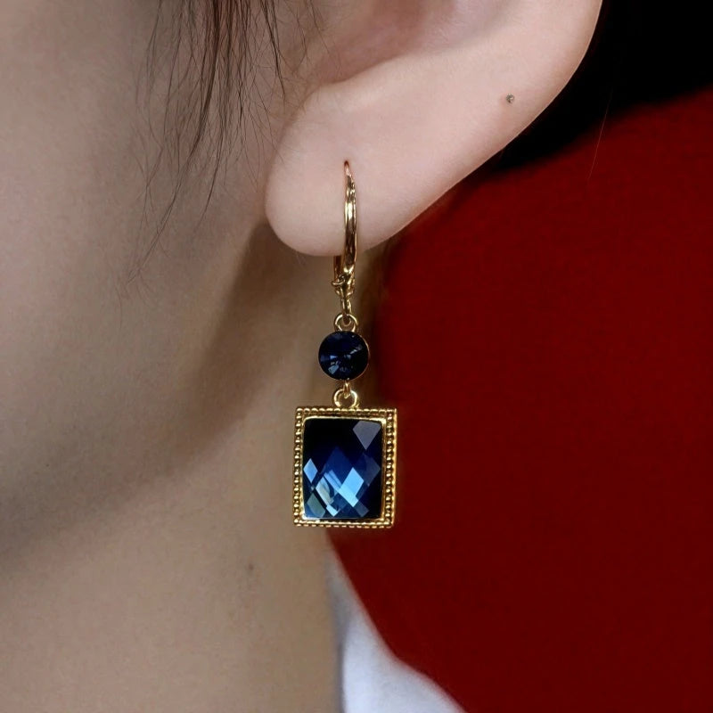 Close-up detail of the sparkling zircons and plating on the Blue Square Crystal Earrings