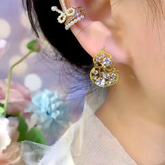 Close-up detail of the sparkling zircons and plating on the Gourd Earrings