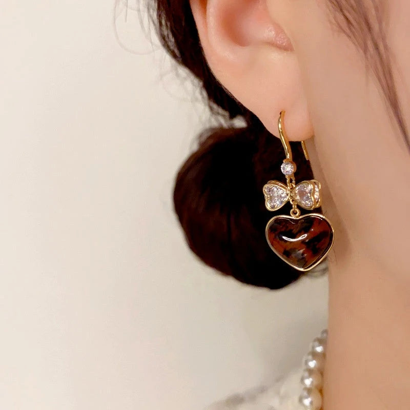 Close-up detail of the sparkling zircons and plating on the Leopard Heart Earrings