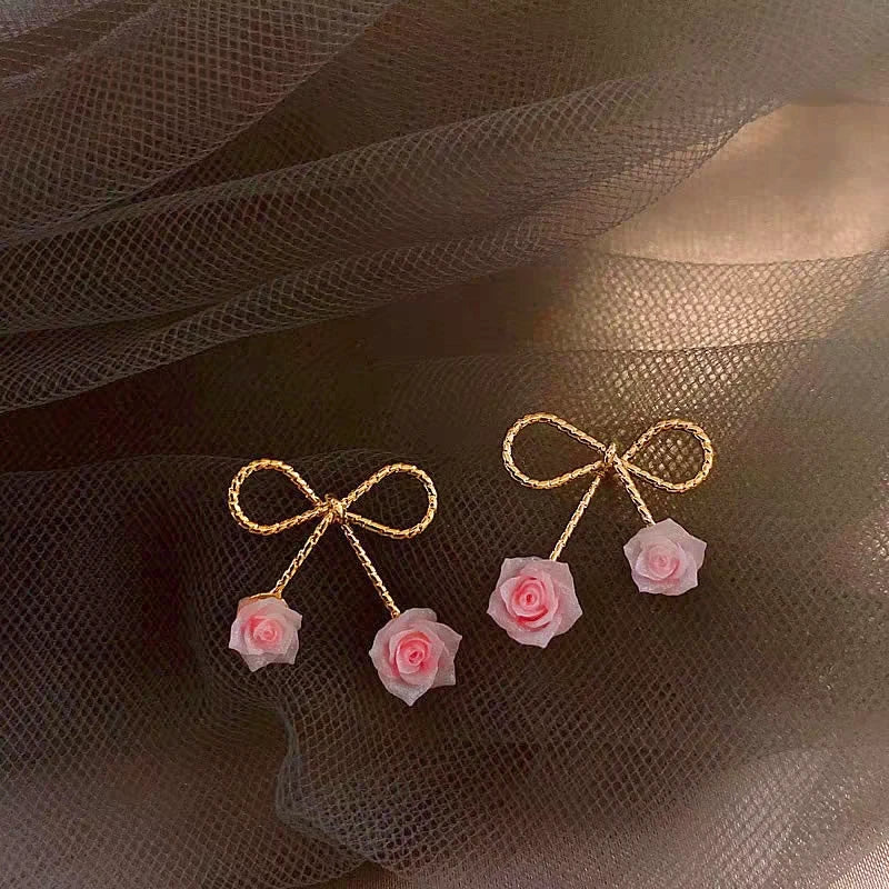 Close-up detail of the sparkling zircons and plating on the Bow Rose Earrings