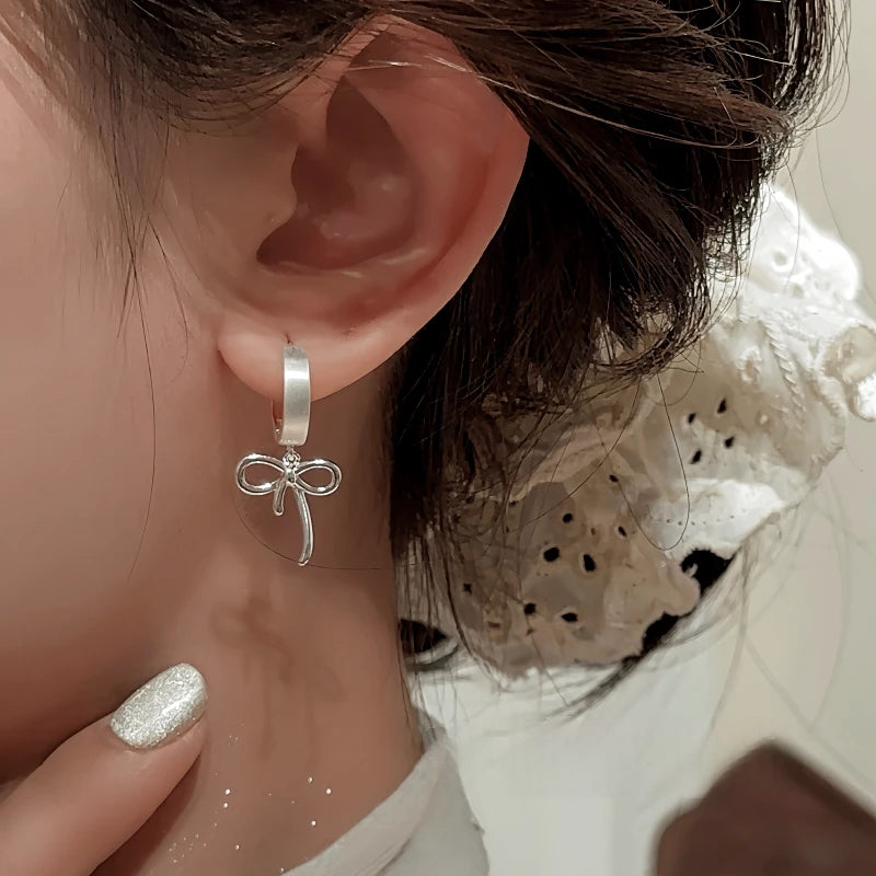 Close-up detail of the sparkling zircons and plating on the Bow Tassel Earrings