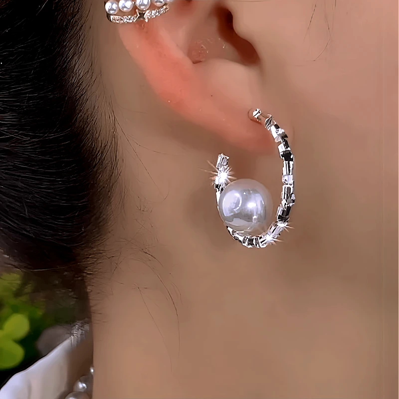 Close-up detail of the sparkling zircons and plating on the Pearl C-Shaped Earrings